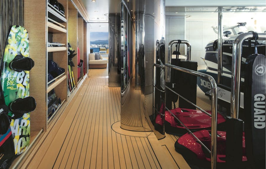 Storage garage with sea bobs, wakeboards, water skis and tender. >